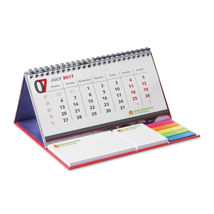 Calendrier de bureau avec couverture rigide, marqueurs et bloc-notes.