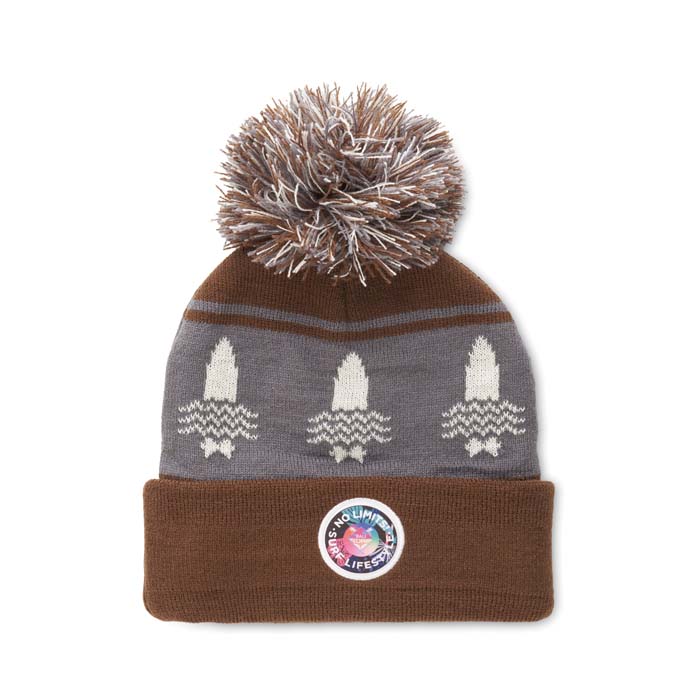Bonnet à revers en jacquard avec pompon en rPET à motif personnalisé.